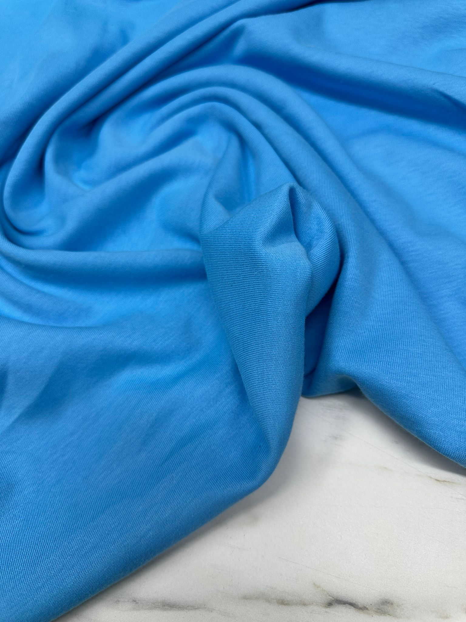 İki İplik Mavi Renk Penye Kumaş Yumuşak Dökümlü